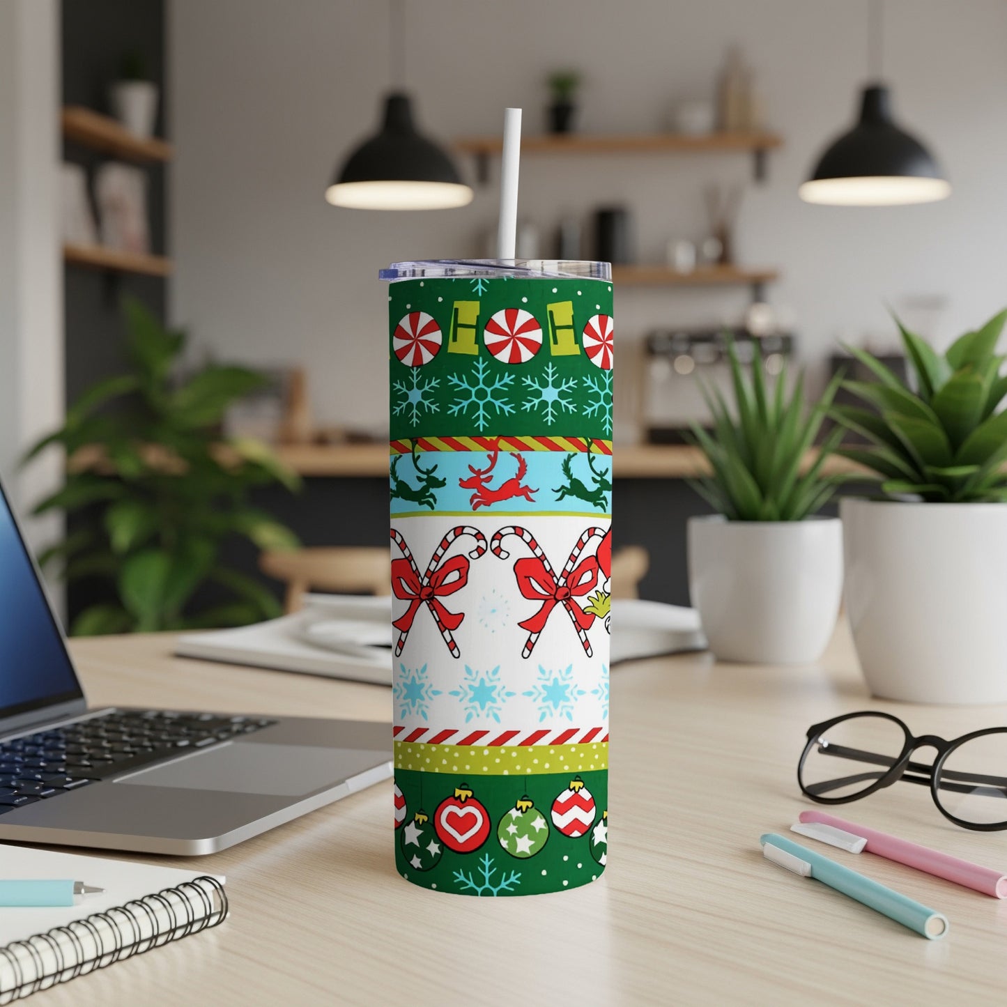 Christmas tumbler with candy canes, ornaments, and festive patterns.