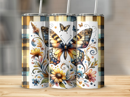 Three tumblers with butterfly and floral designs, plaid accents, and straws.