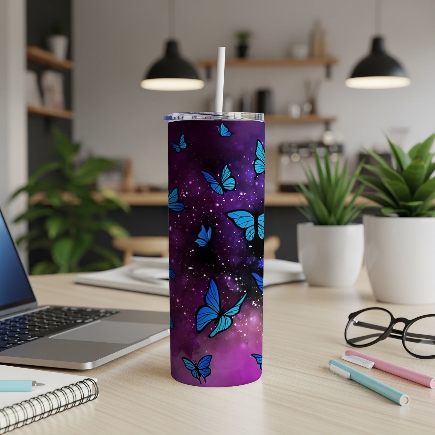 Purple tumbler with blue butterflies on a galaxy background.