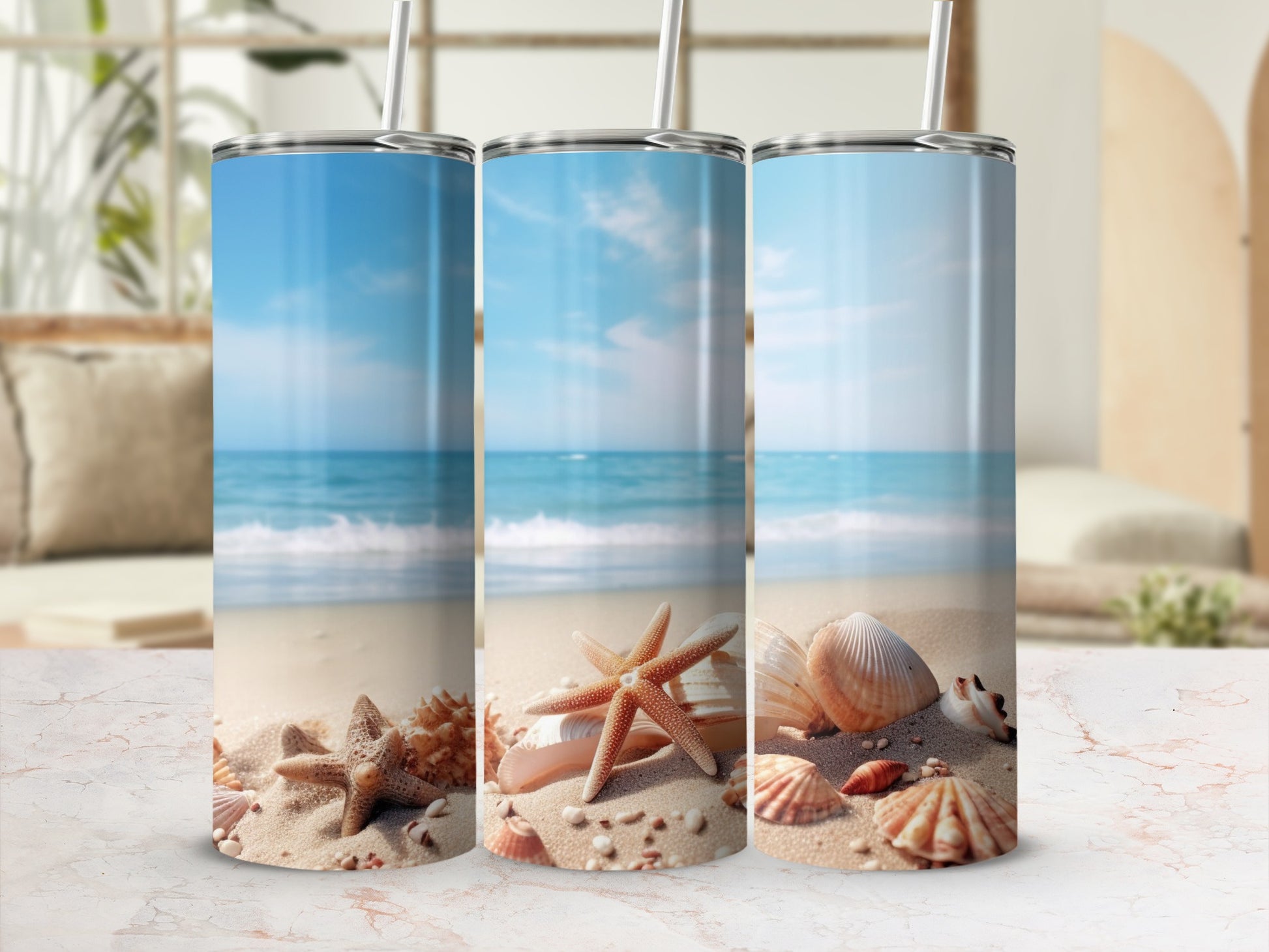 Three tumblers with beach scene, shells, and starfish.