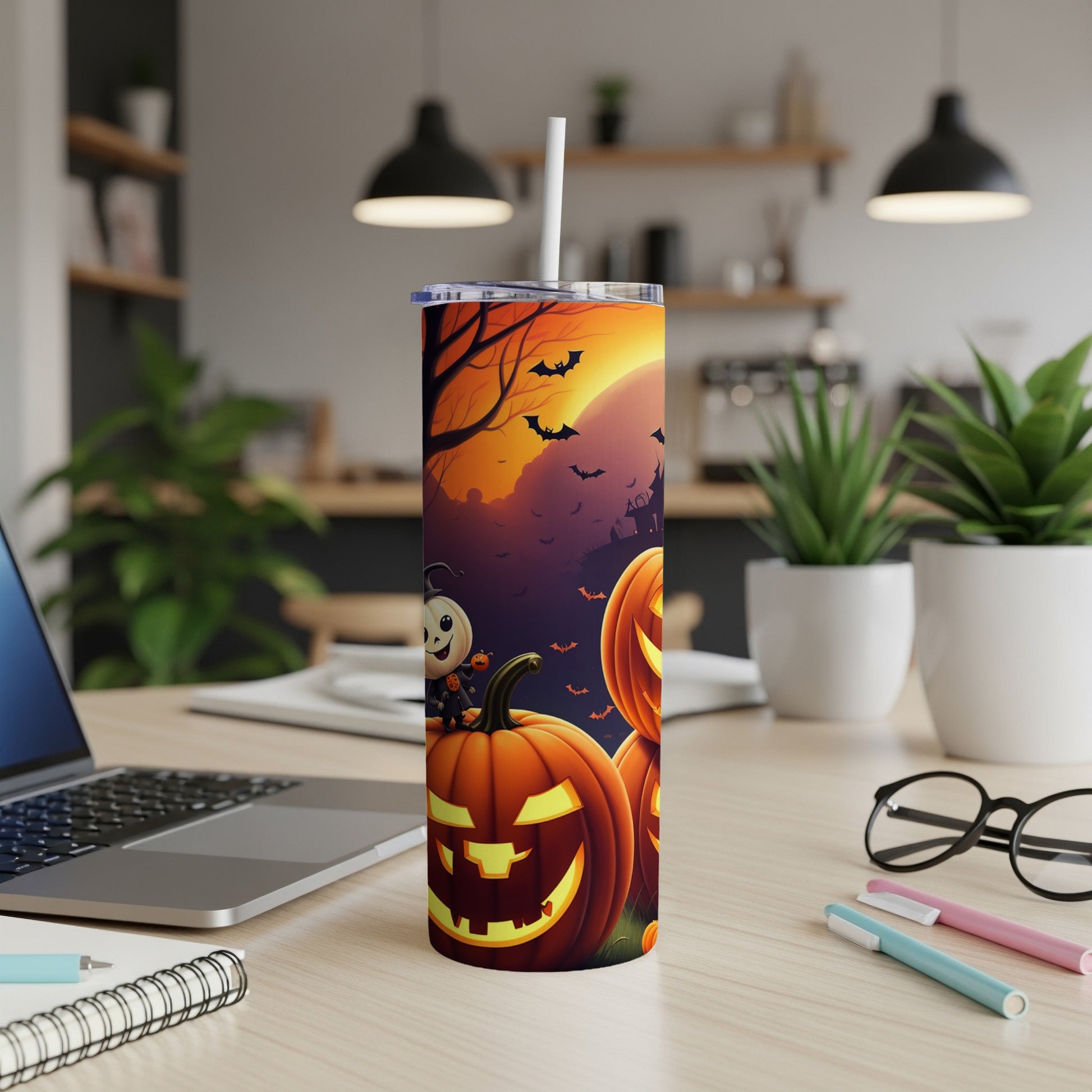 Halloween tumbler with pumpkins, bats, and a spooky moon scene.