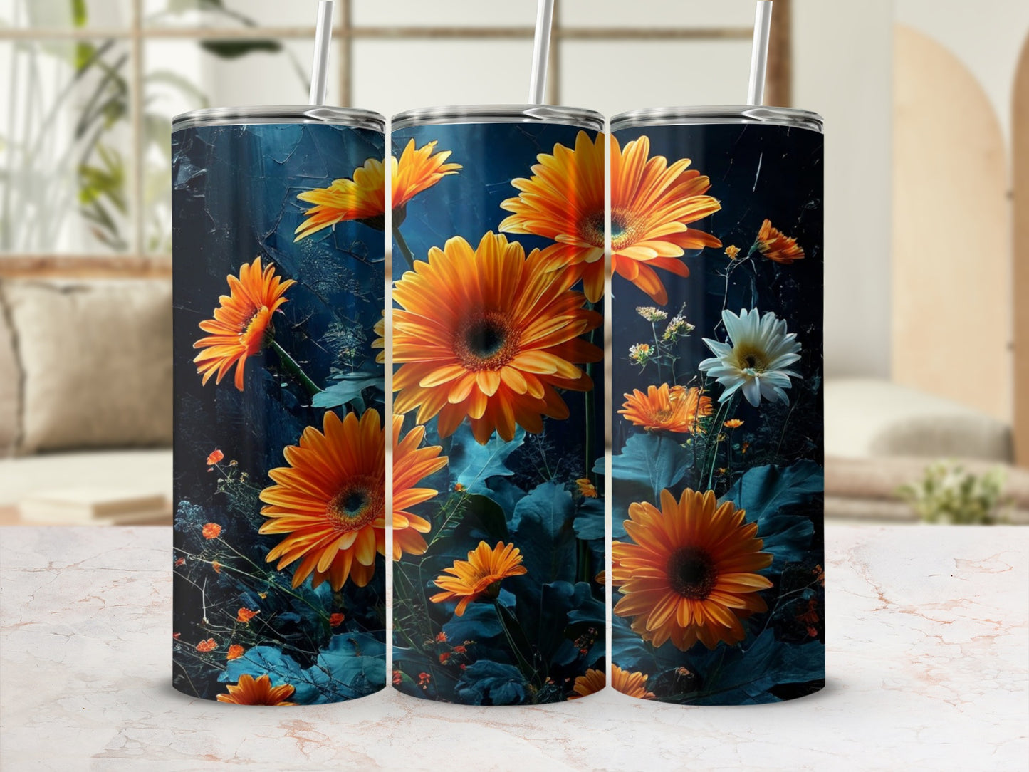 Three tumblers with orange gerbera daisies and dark blue background.