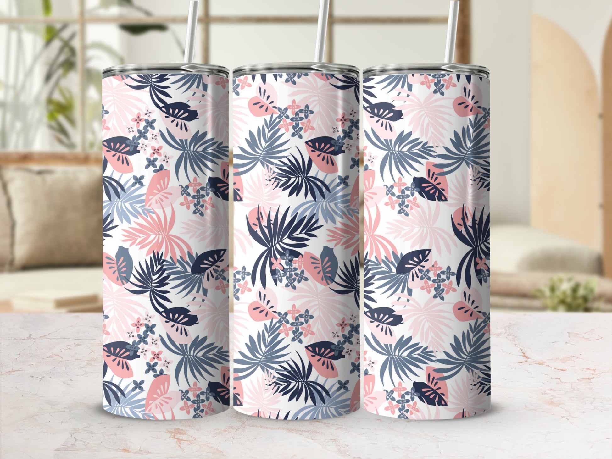 Three tumblers with a tropical leaf and floral pattern.