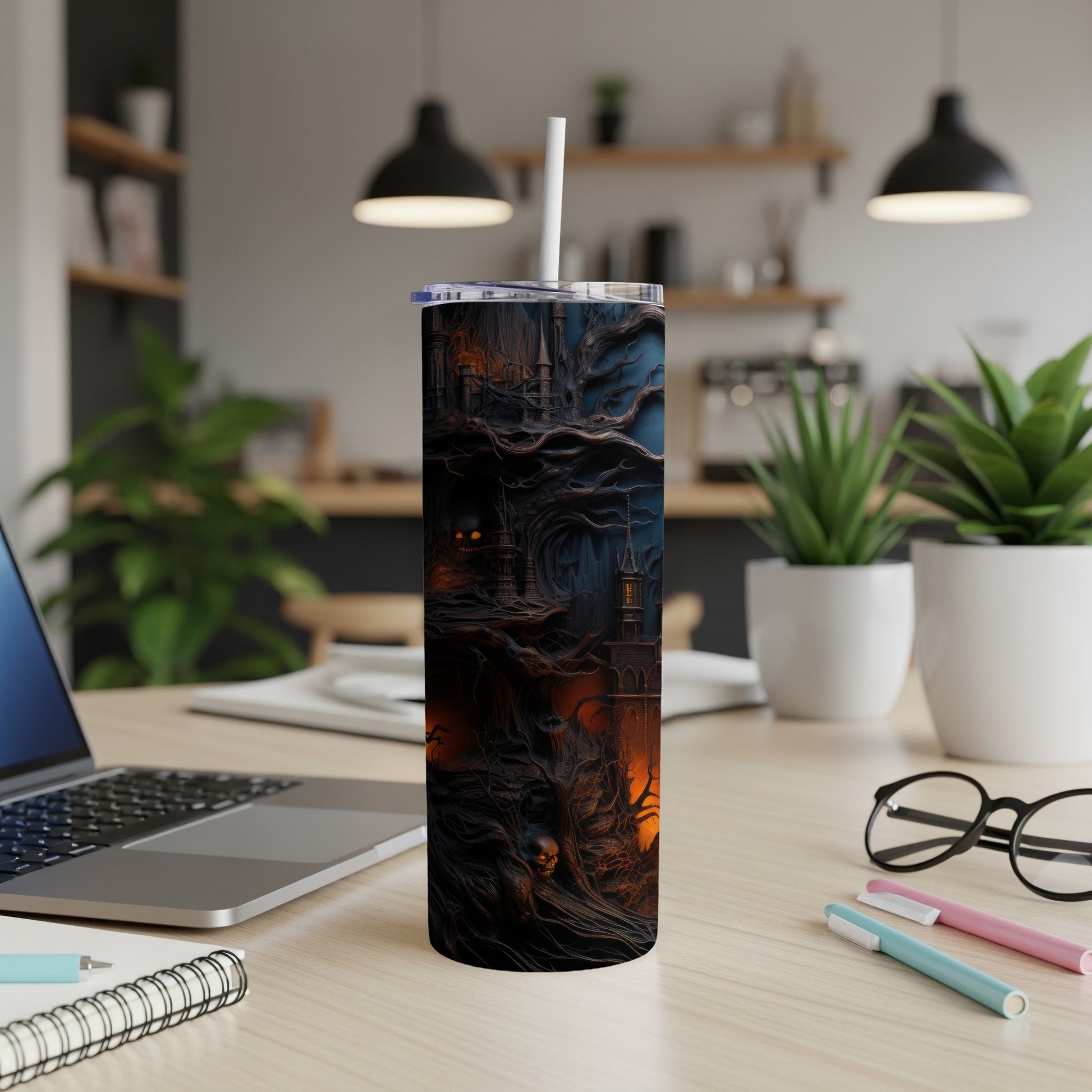 Tumbler with a spooky castle, bare trees, and a skull design.