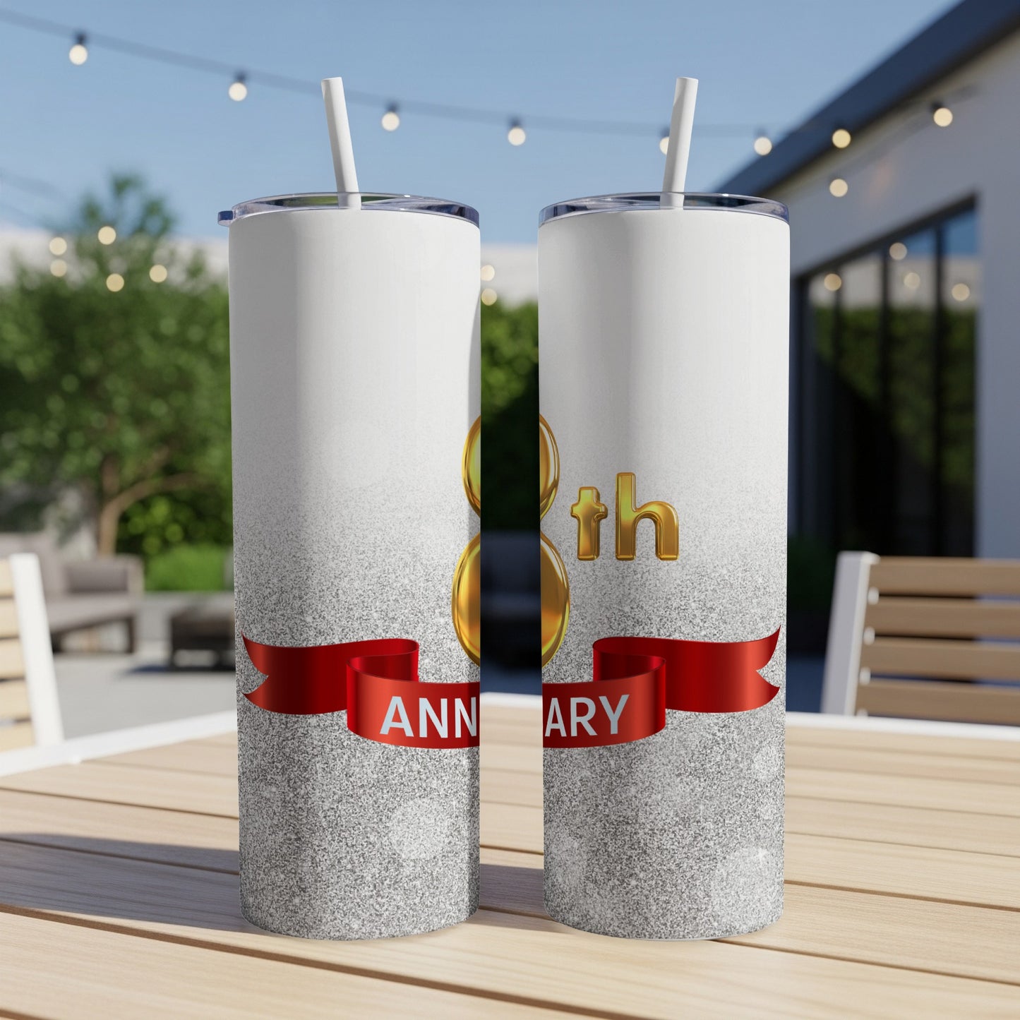 Two white tumblers with glitter and a red ribbon reading "ANNIVERSARY".