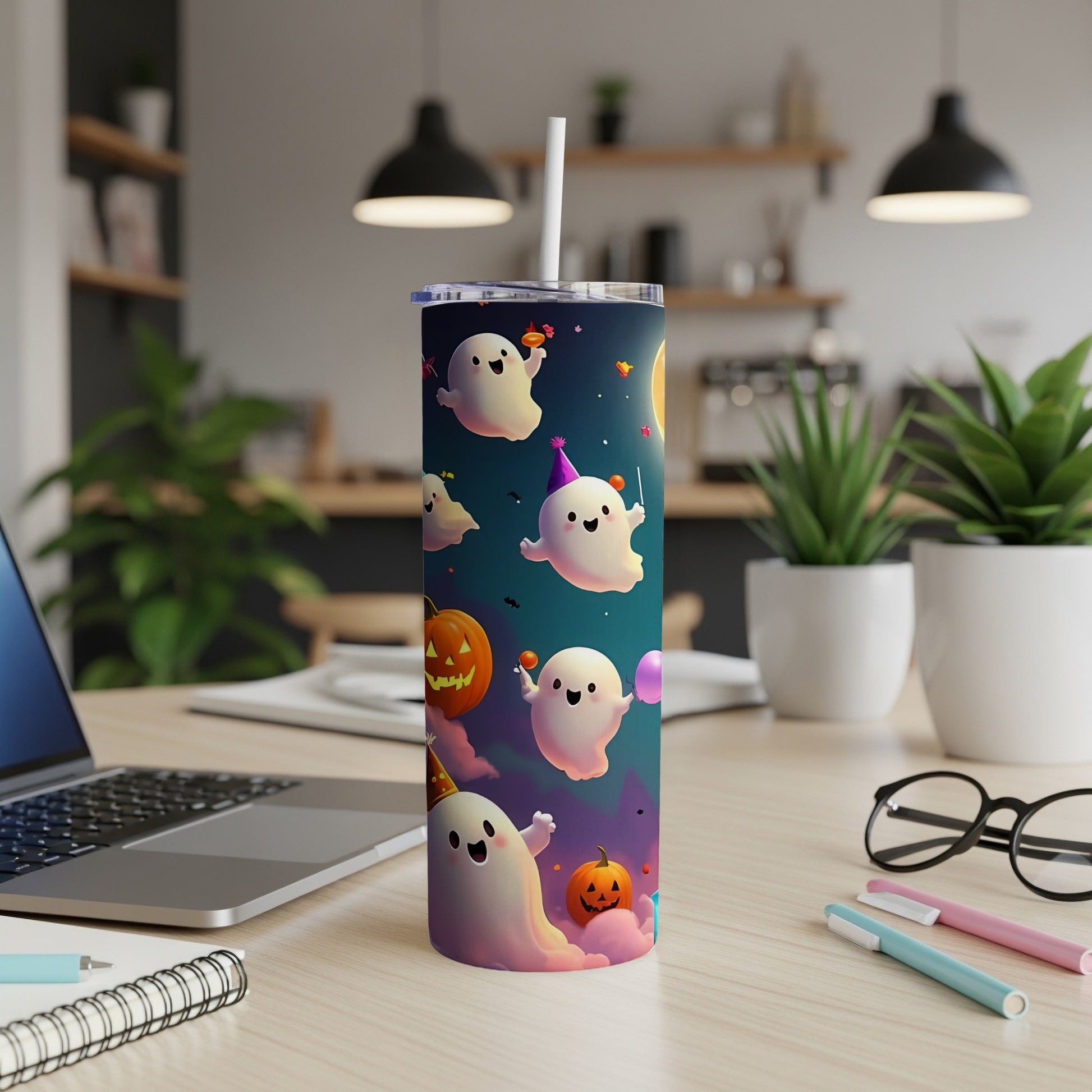 Tumbler with cute ghosts, pumpkins, and party hats on a dark blue background.