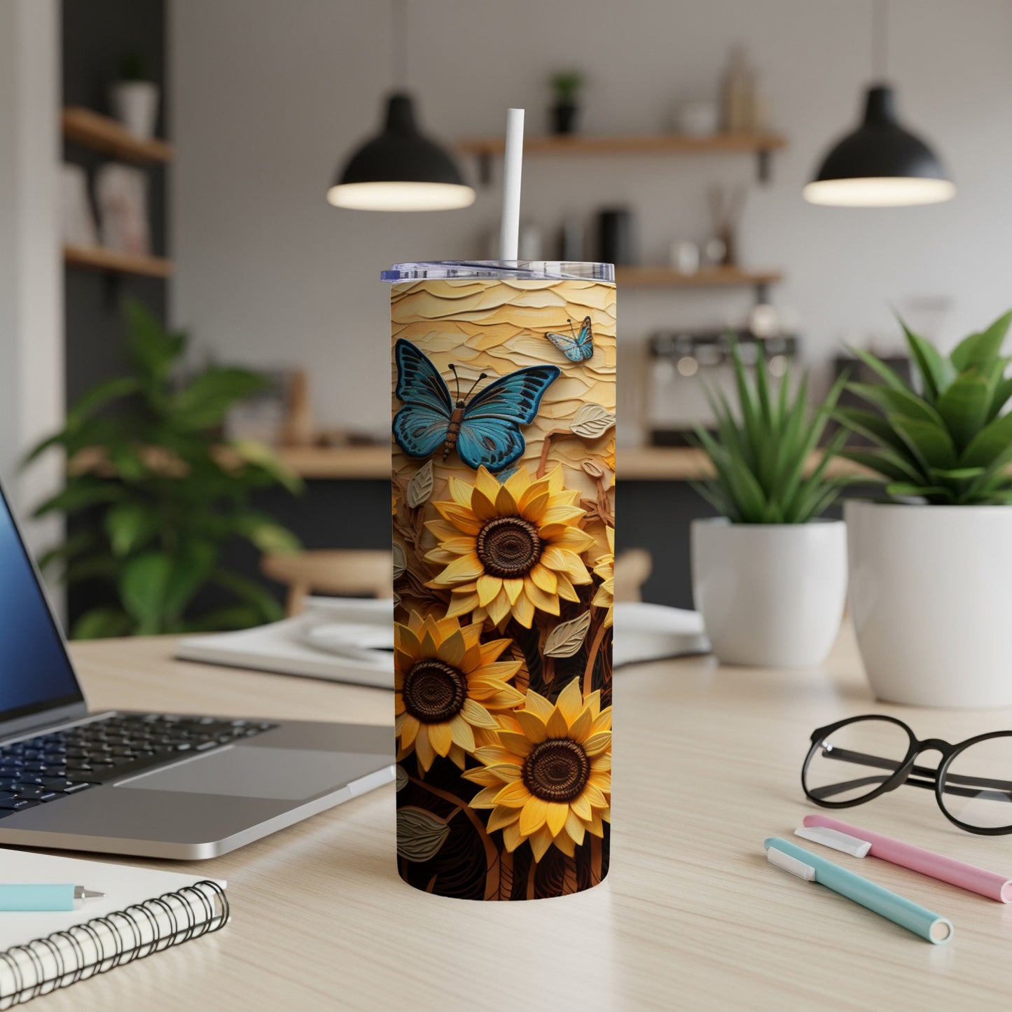 Sunflower and butterfly design on a white tumbler with a straw.