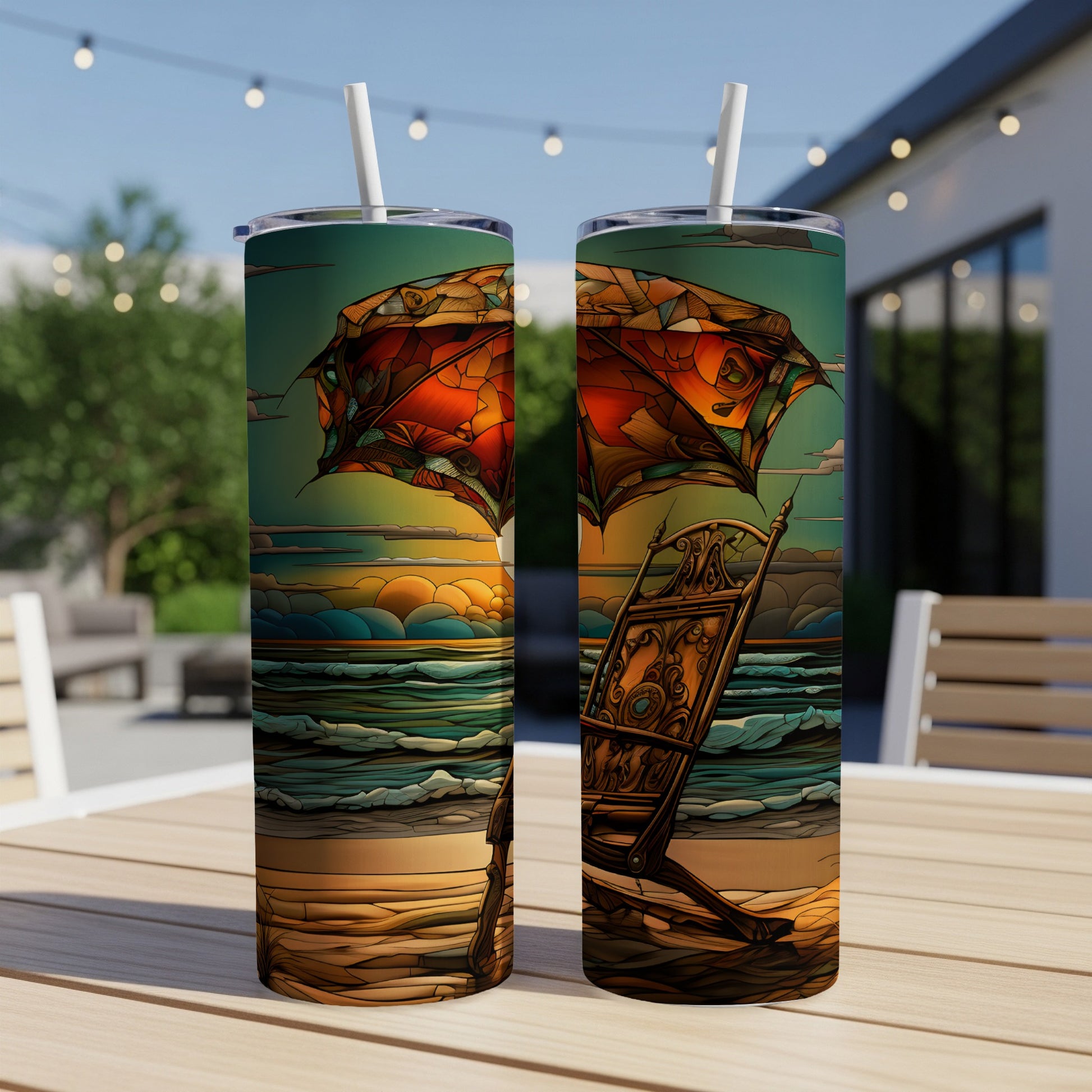 Two tumblers with a surreal beach scene featuring a large umbrella and lounge chair.