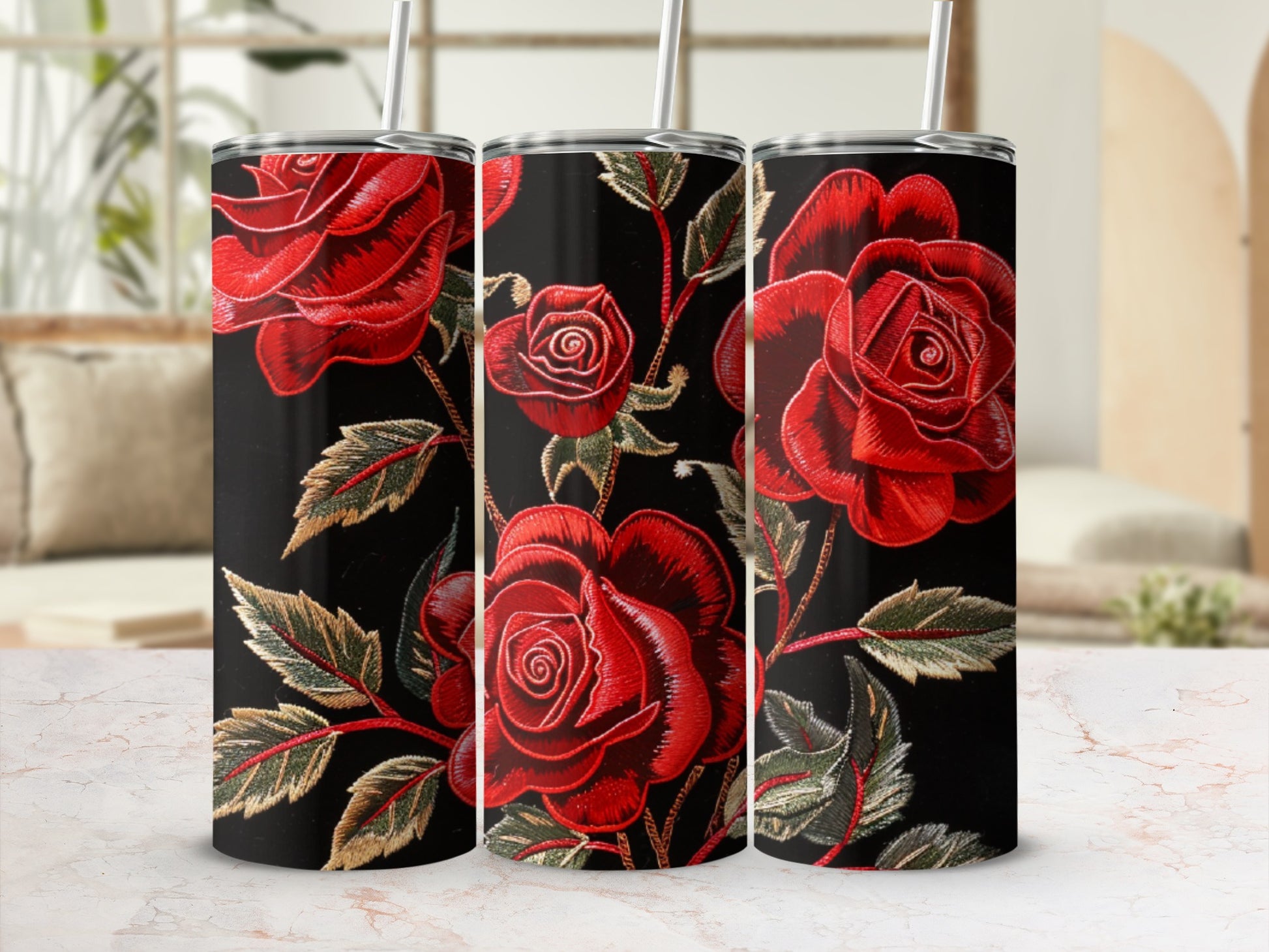 Three tumblers with red roses and green leaves on a black background.