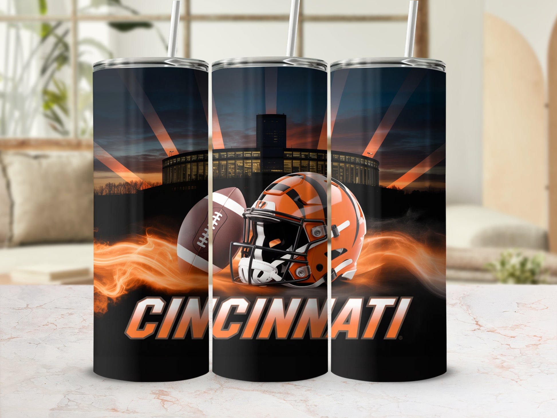 Football helmet and ball with "CINCINNATI" text and stadium sunset background.