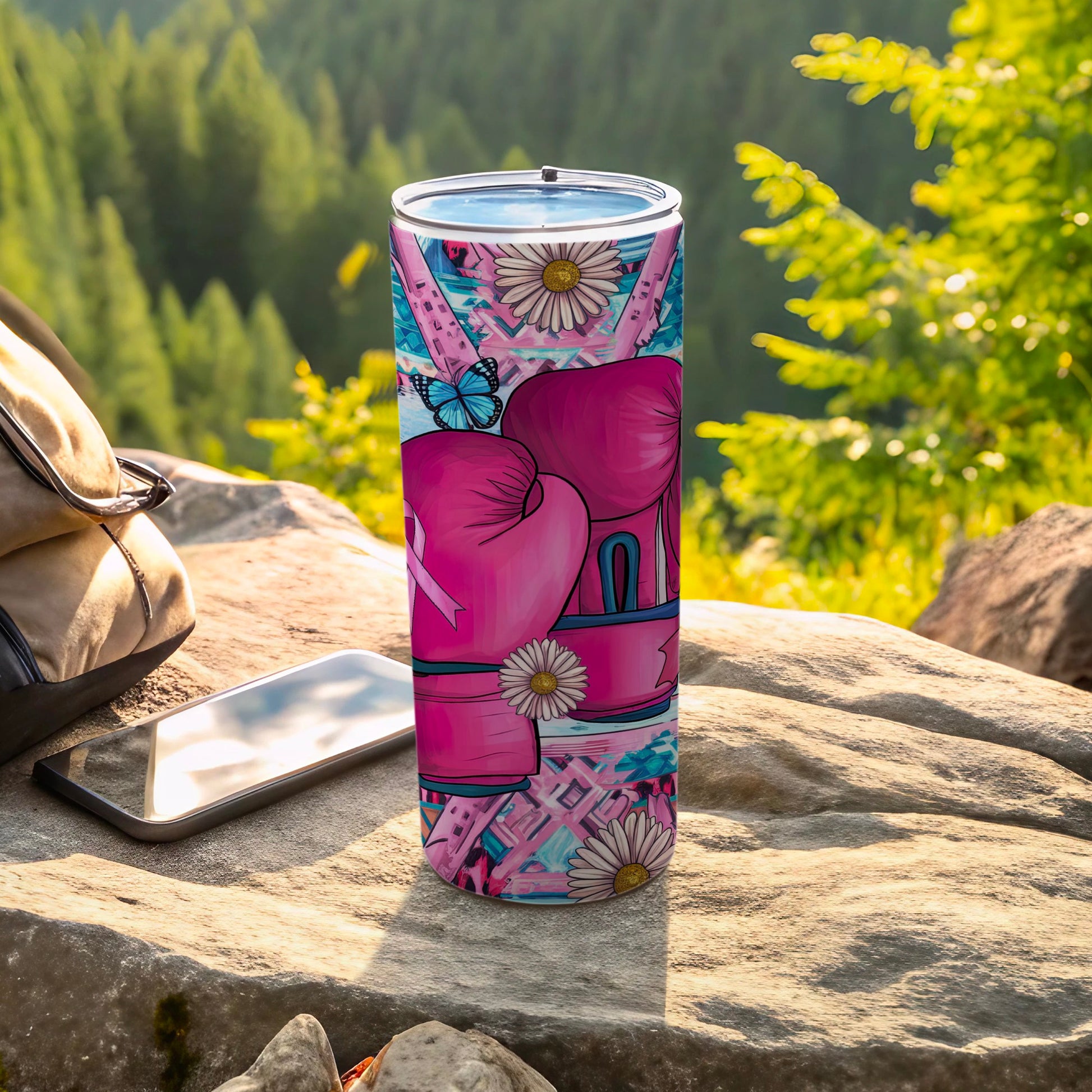 Pink boxing gloves and flowers on a tumbler with a butterfly.