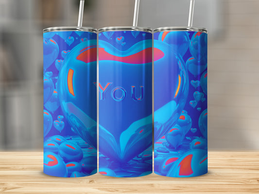 Three blue heart-shaped tumblers with "You" text, on a wooden surface.
