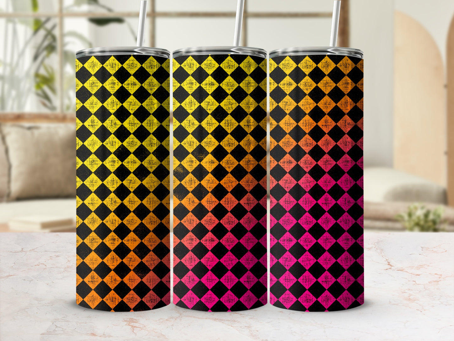 Three tumblers with a checkered diamond pattern in yellow, orange, and pink.