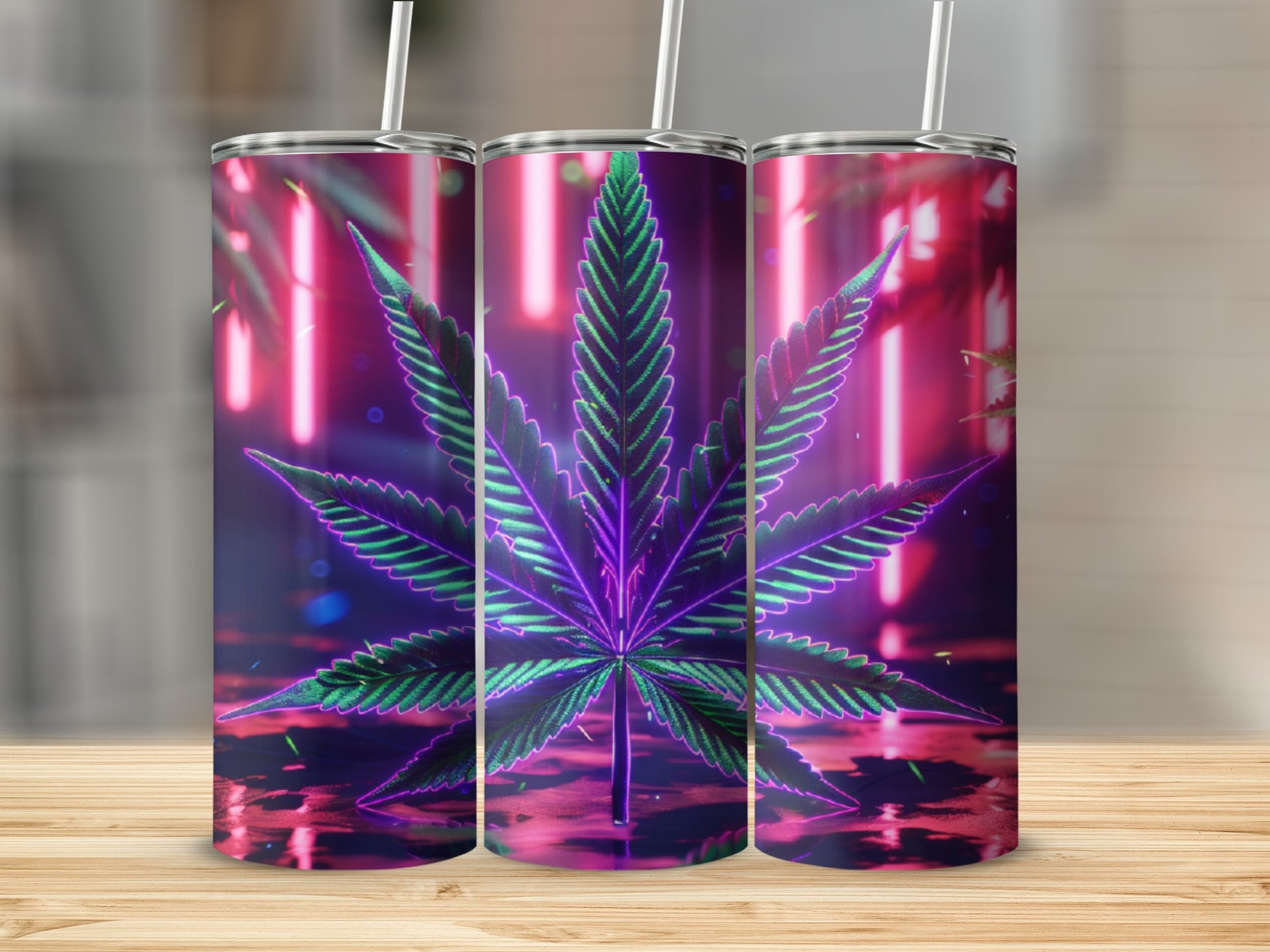 Three tall tumblers with a neon cannabis leaf design.