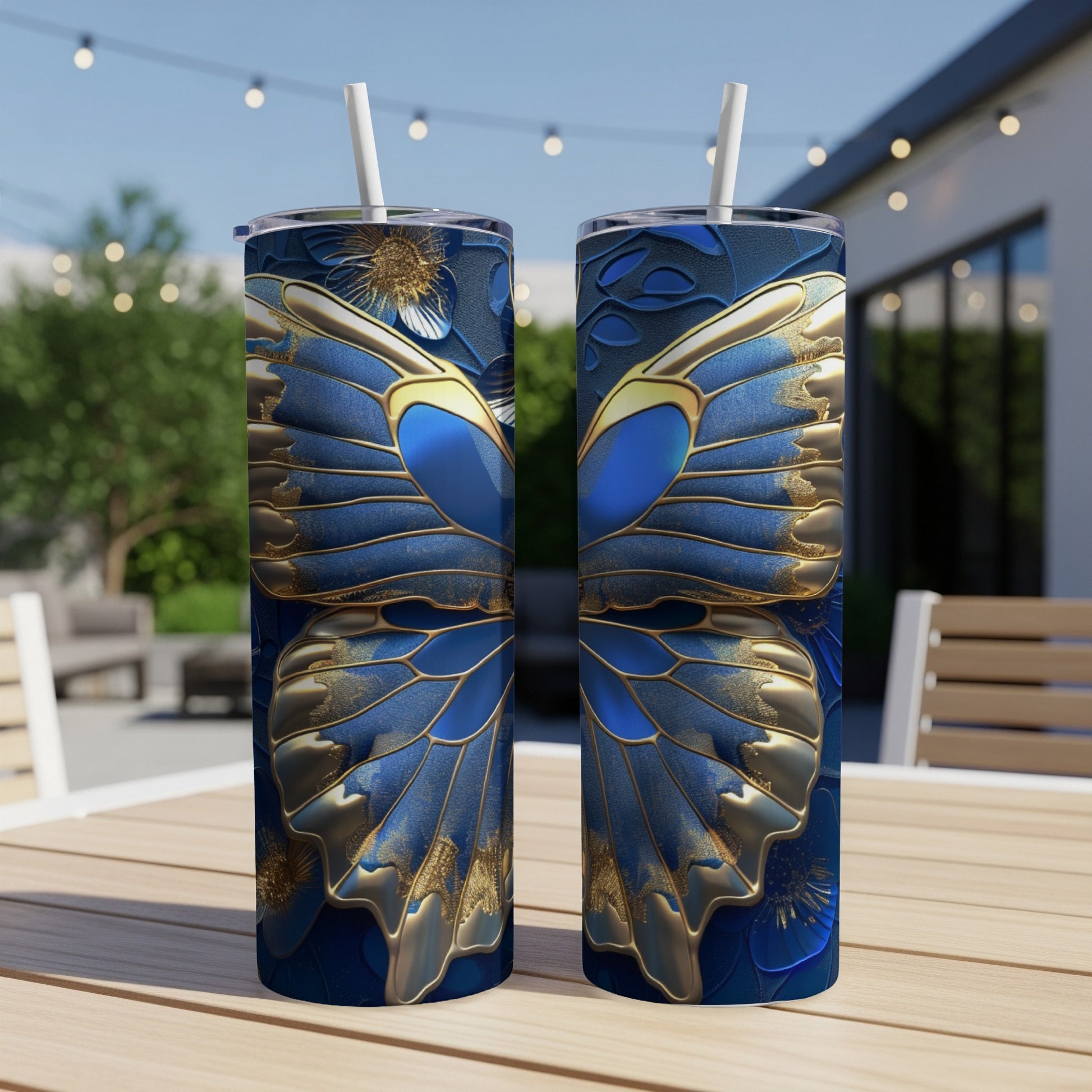 Two tall tumblers with a blue and gold butterfly wing design.