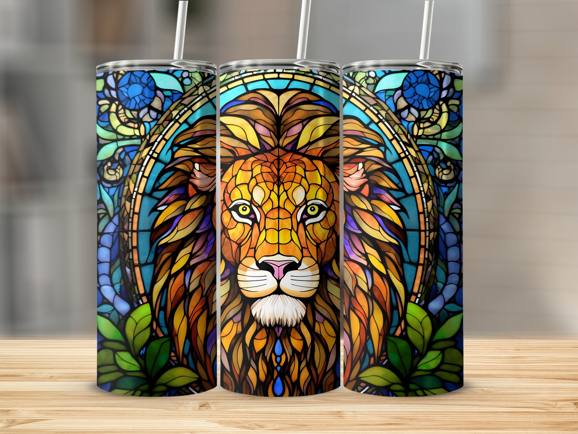 Three tumblers with stained glass lion designs, featuring blue and green accents.