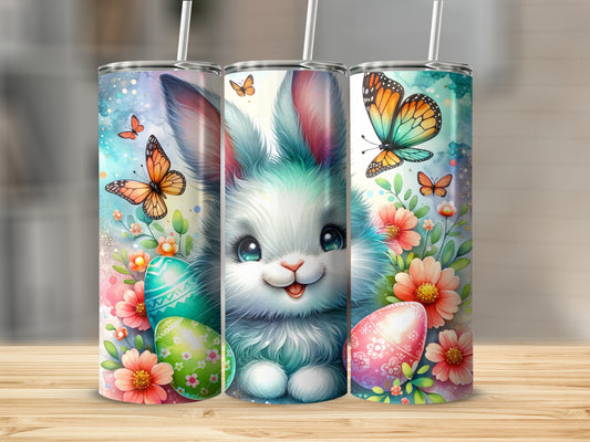 Easter bunny with colorful eggs and butterflies on a floral tumbler.