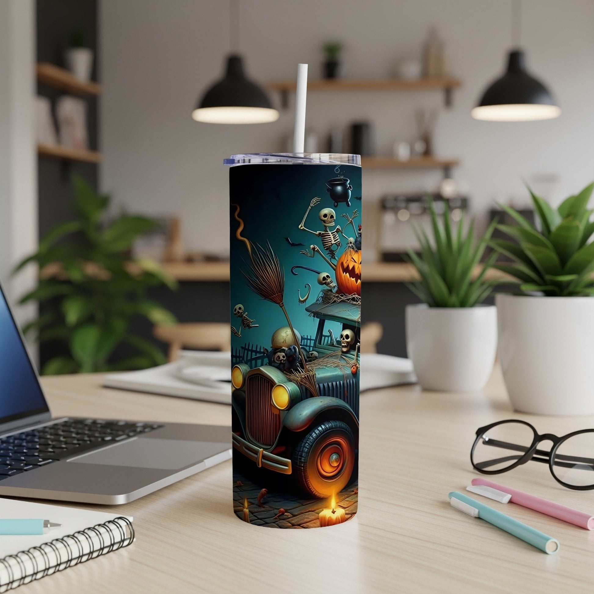 Tumbler with Halloween skeletons driving a vintage car and pumpkin design.