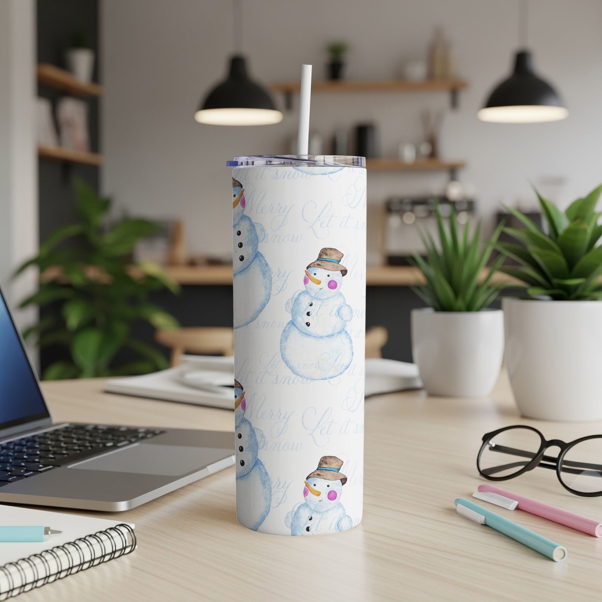 Tall white tumbler with repeating snowman and "Let it snow" text pattern.