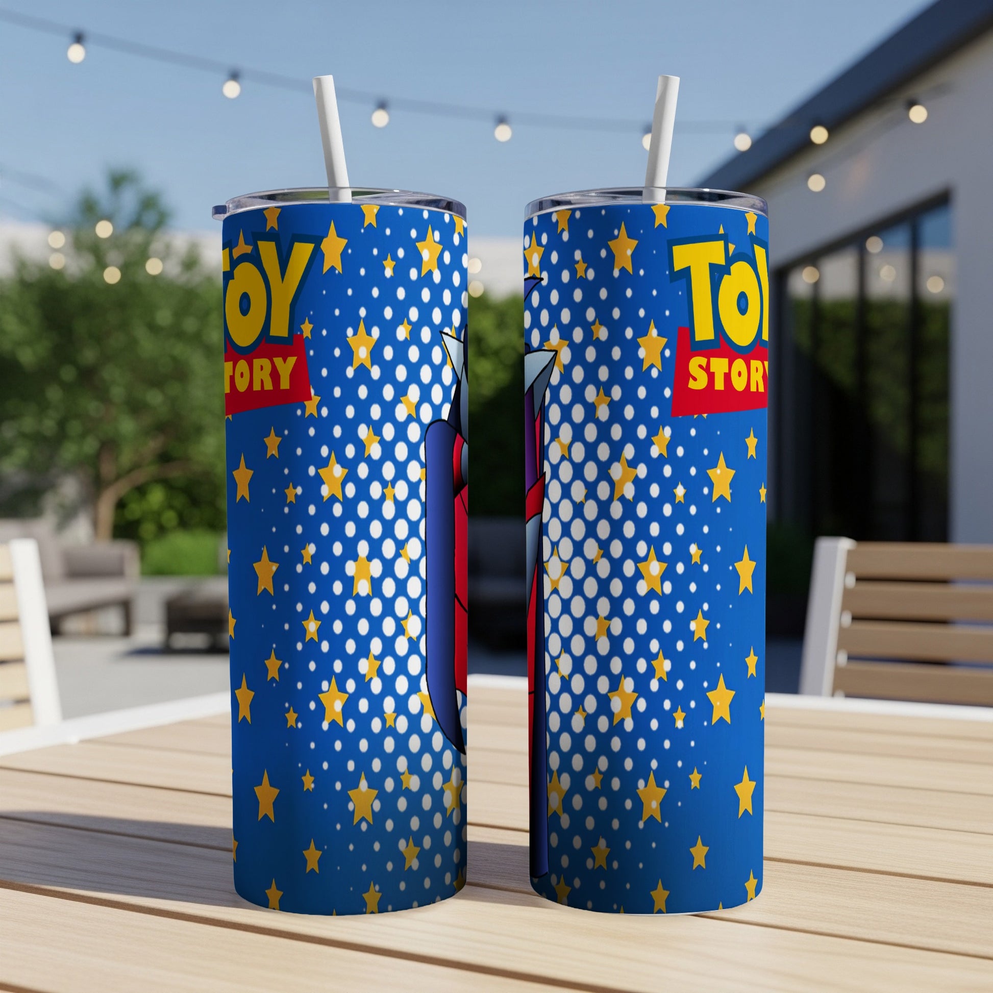 Toy Story tumbler with characters and star pattern on a table.
