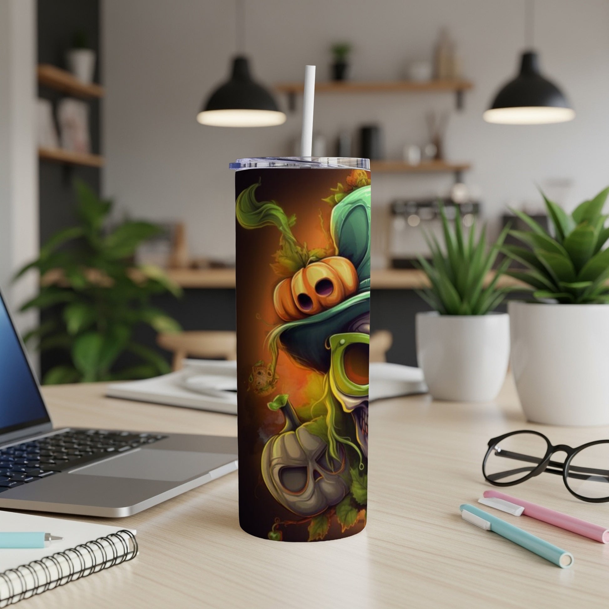 Tumbler with a Halloween-themed skull, pumpkin, and leafy design.
