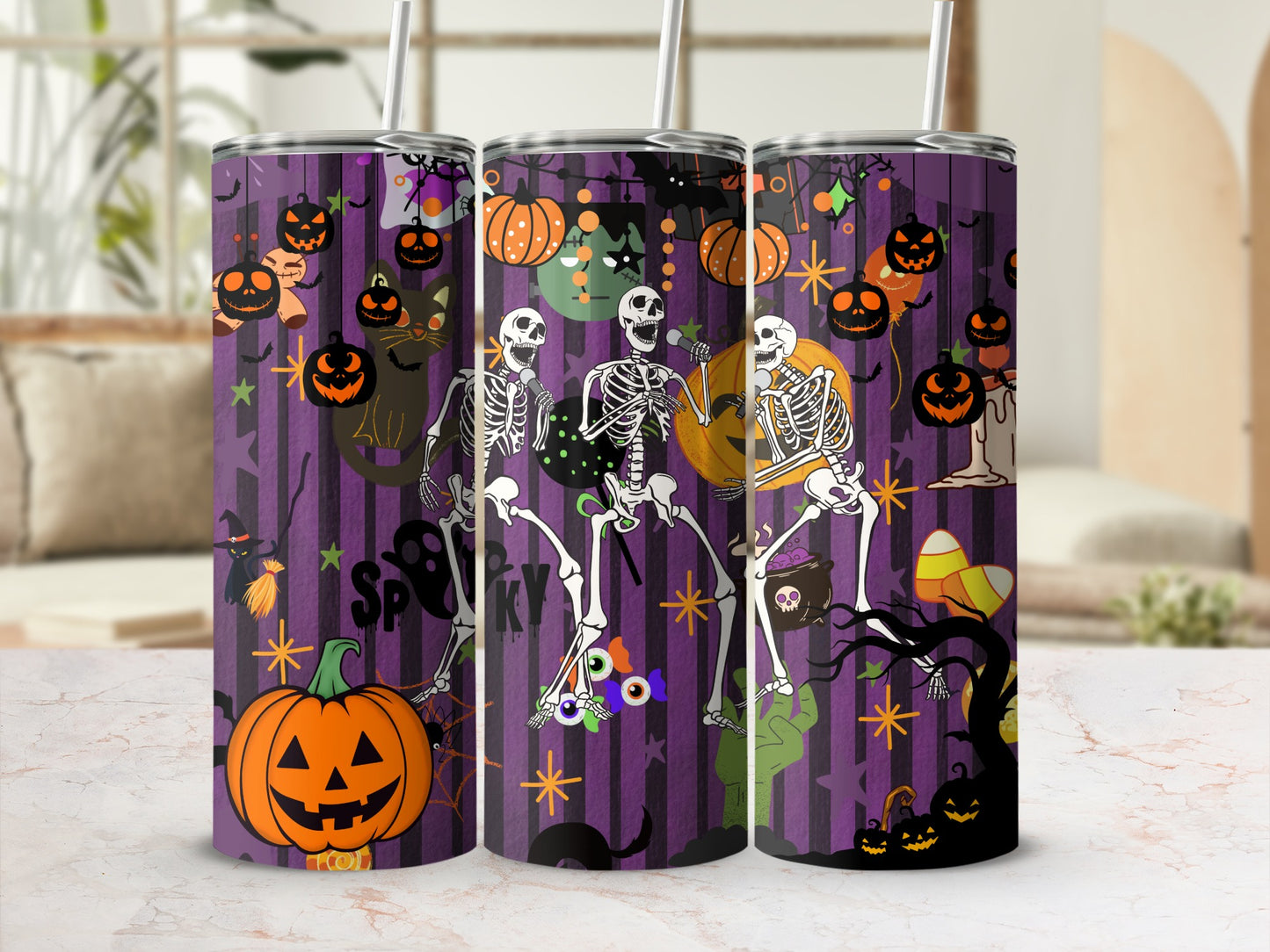 Purple tumbler with Halloween skeletons, pumpkins, and candy corn design.