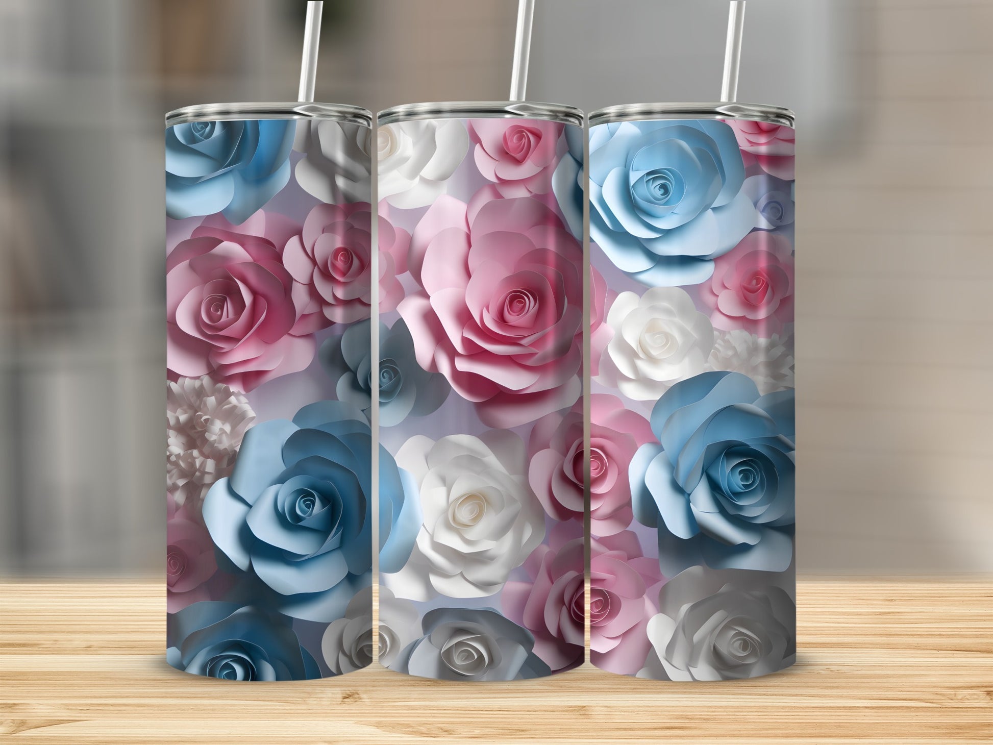 Three tumblers with a floral pattern of pink, blue, and white roses.