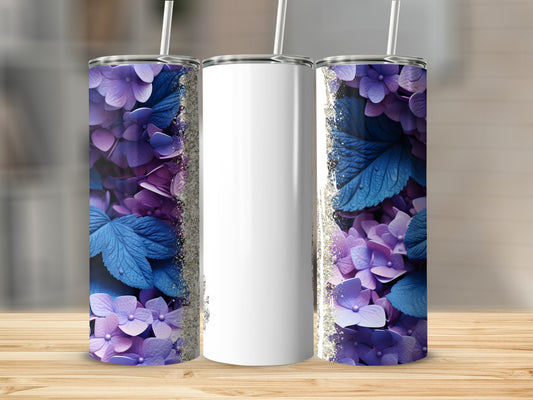 Three purple floral tumblers with gold glitter accents on a wooden surface.
