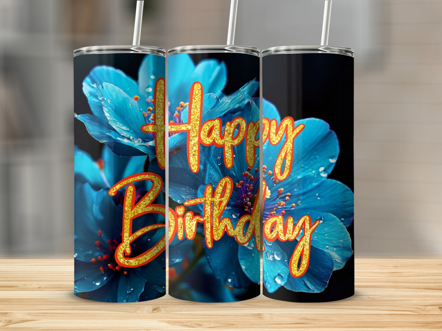 Blue flowers and "Happy Birthday" text on a cylindrical tumbler.