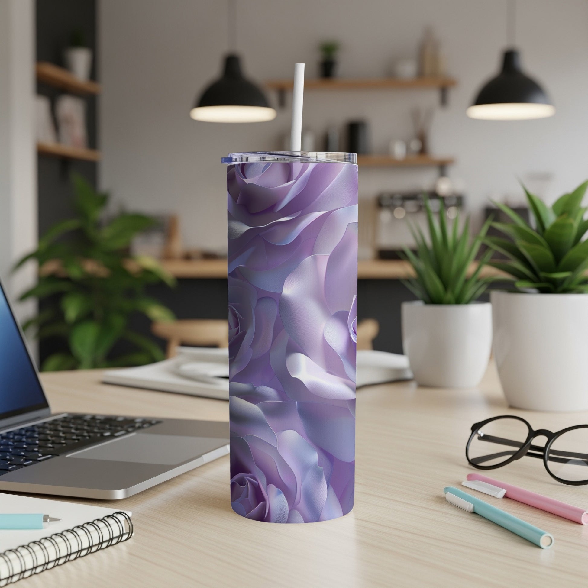 Purple floral textured tumbler with white straw on a desk.