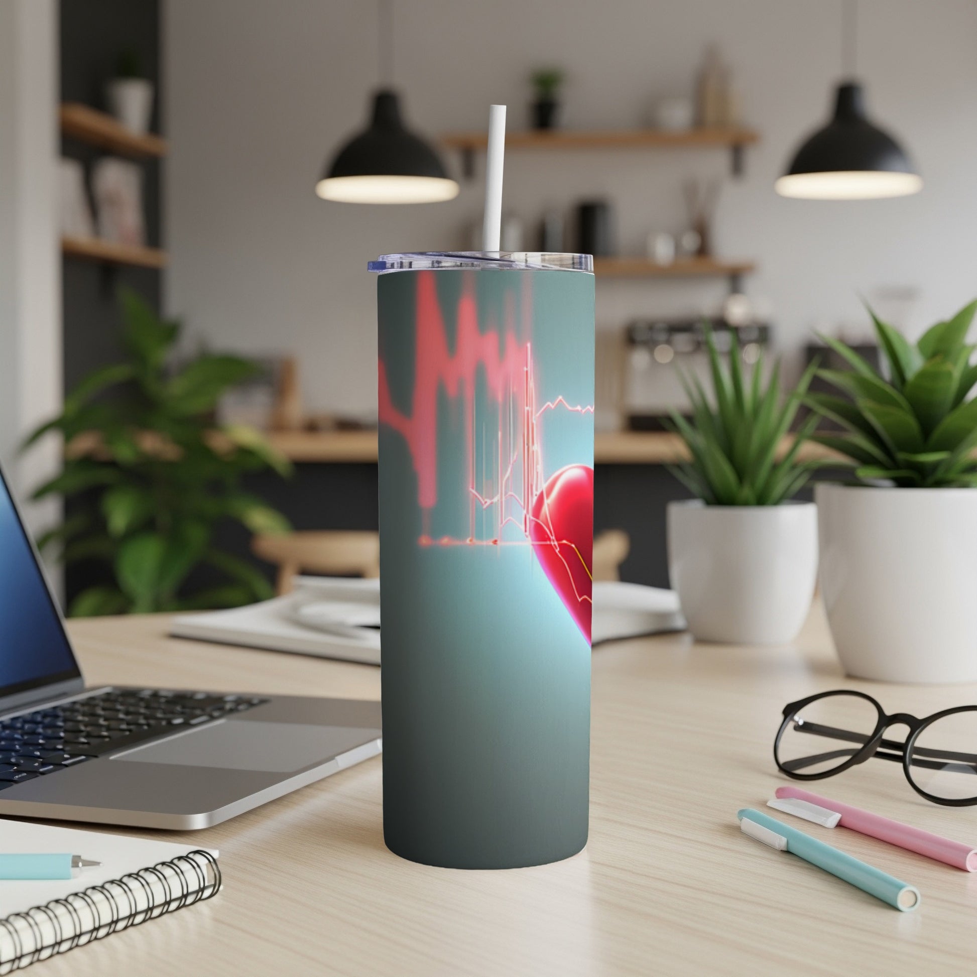 Red heart graphic with heartbeat line on a stainless steel tumbler.