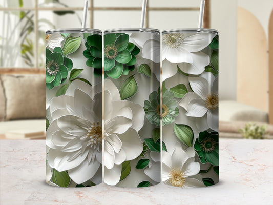 Three floral-patterned tumblers with white and green flowers and leaves.