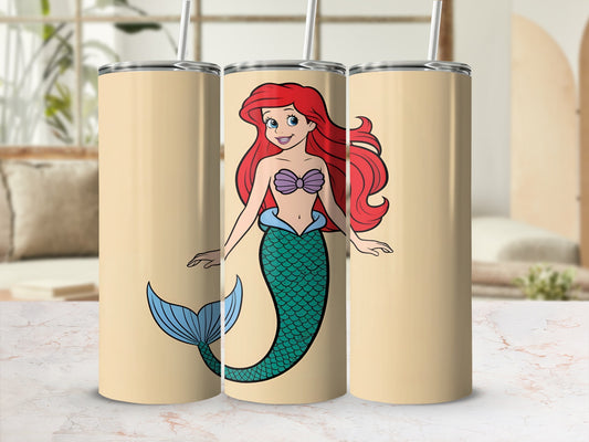 Ariel the mermaid on a beige tumbler with a straw.