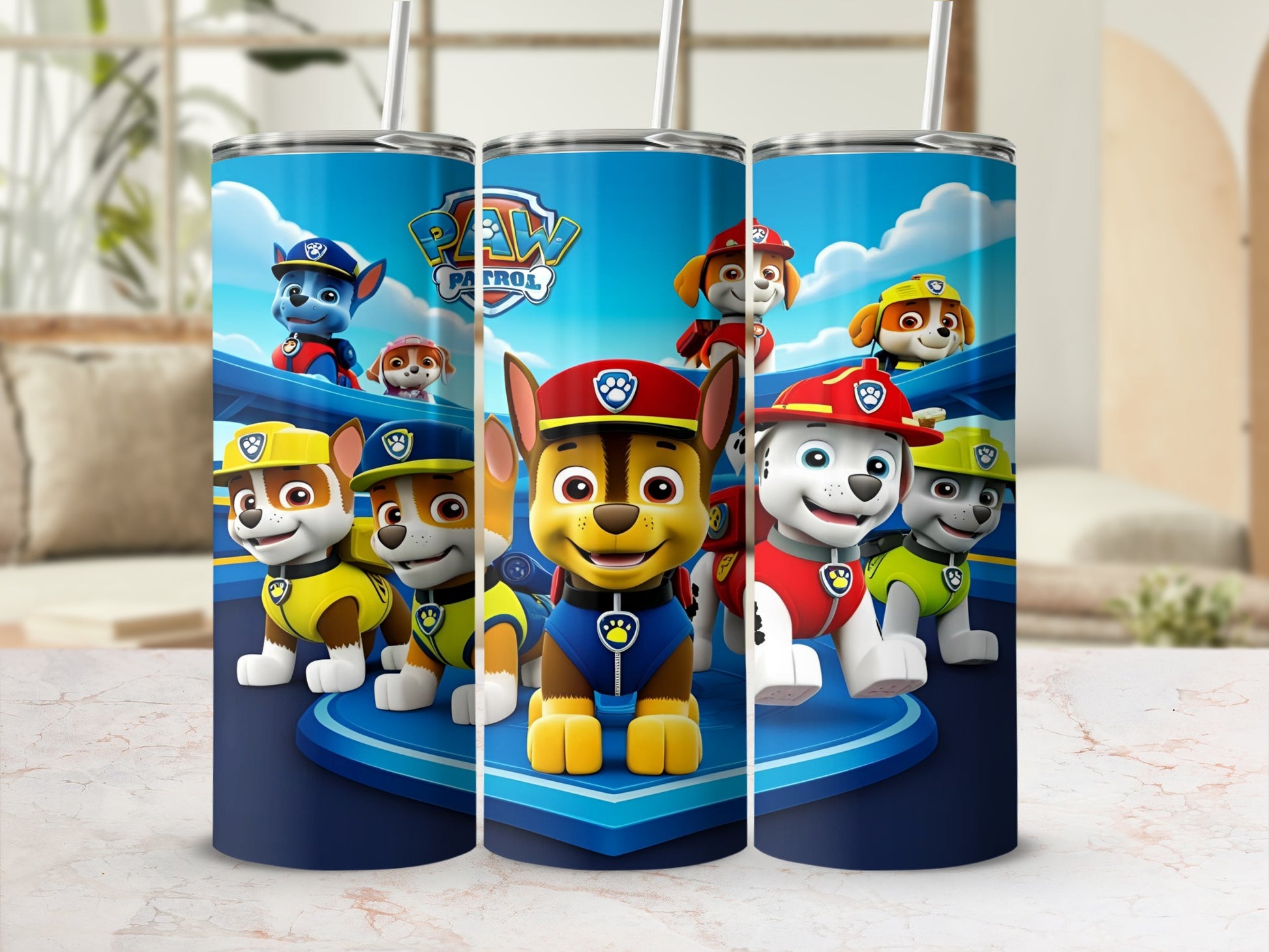 Paw Patrol characters Chase, Marshall, and Rubble on a blue tumbler.