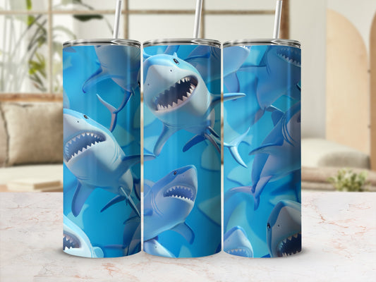 Three tumblers with a repeating pattern of cartoonish blue sharks.