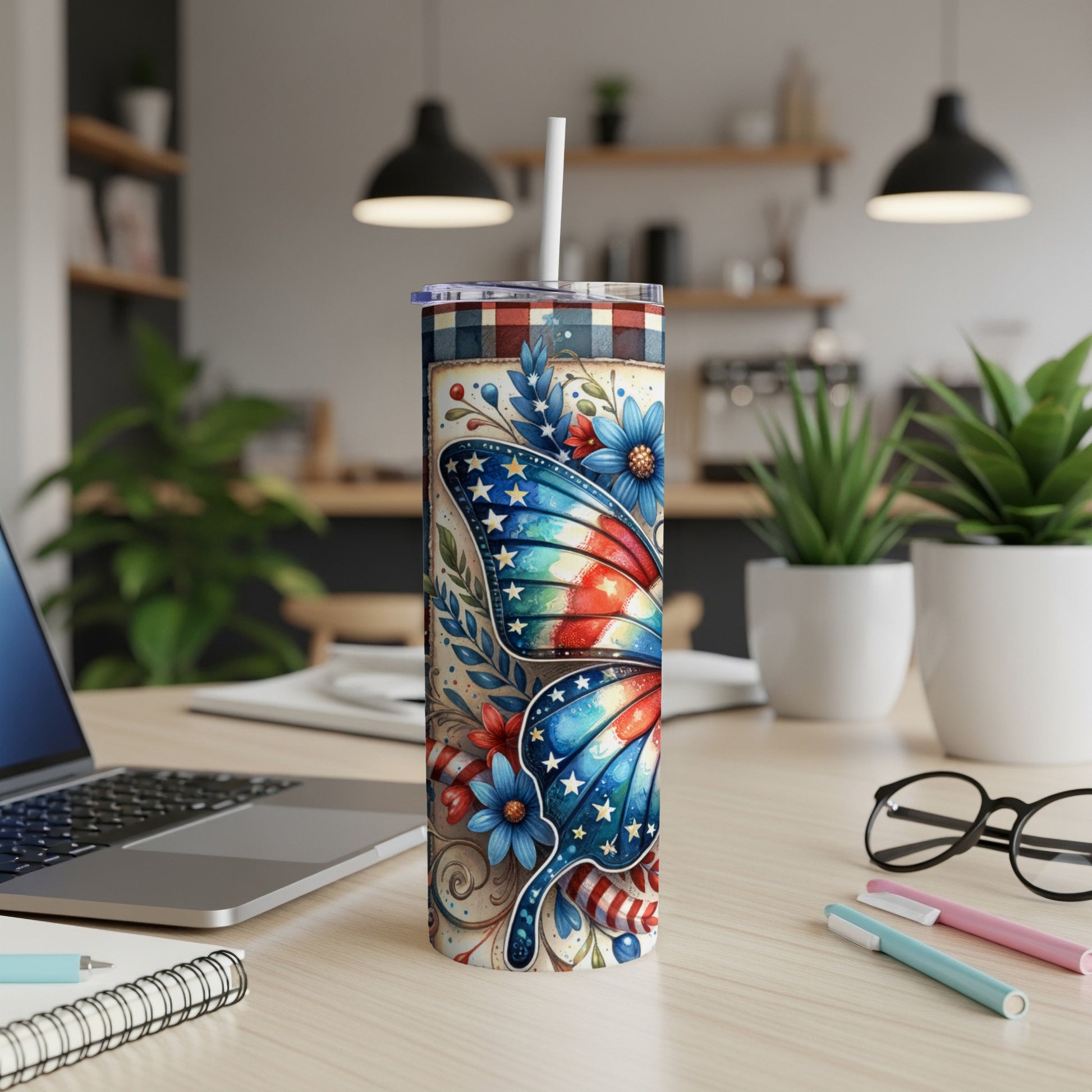 Tumbler with patriotic butterfly and floral design, plaid lid.