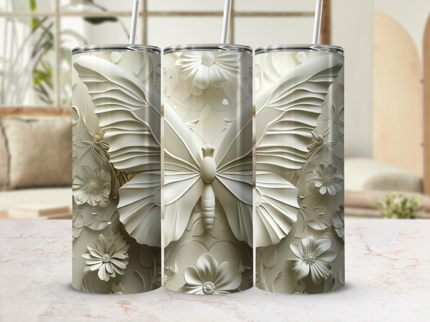 Three white tumblers with embossed butterfly and floral designs.
