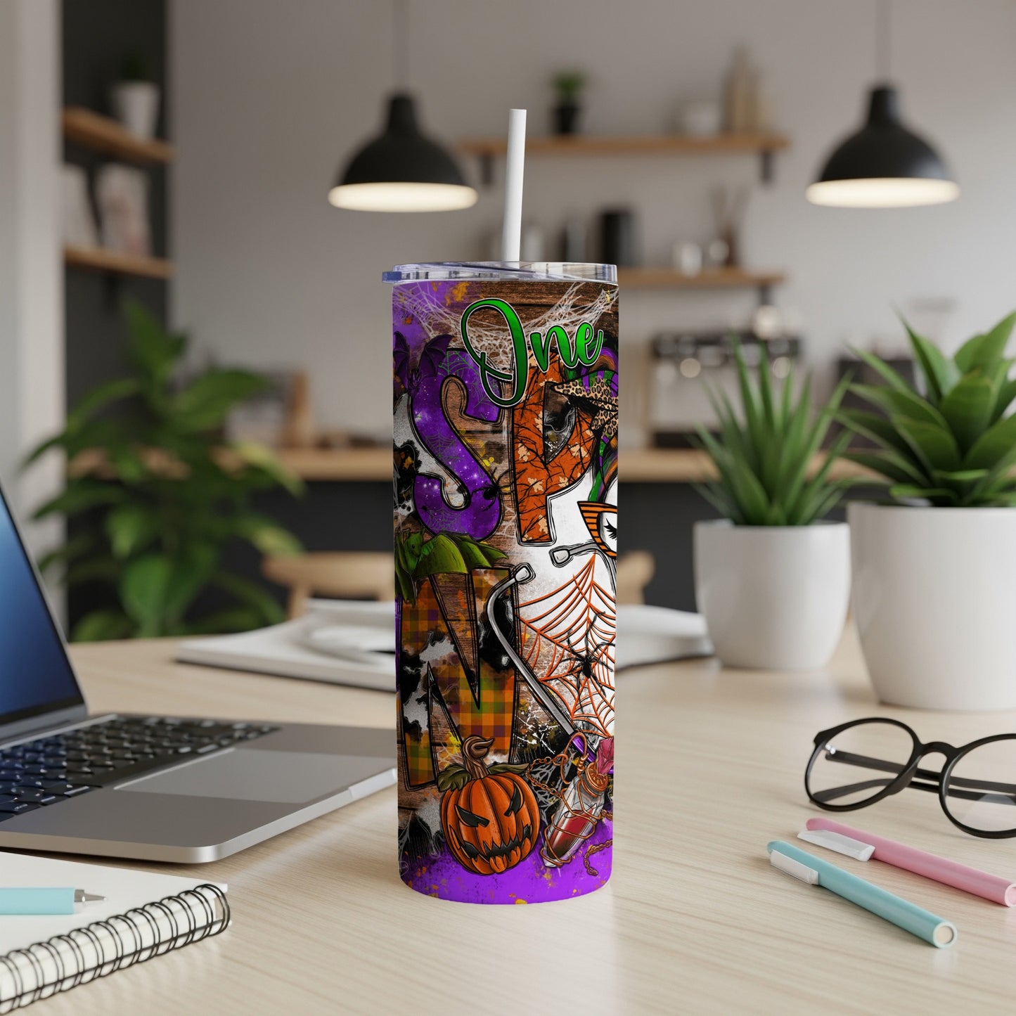 Halloween themed tumbler with "SPOOKY" text and pumpkin, spiderweb, and ghost graphics.