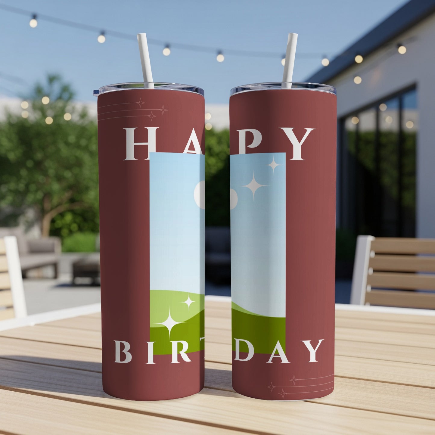 Two maroon tumblers with white straws display "HAPPY BIRTHDAY" in white text.