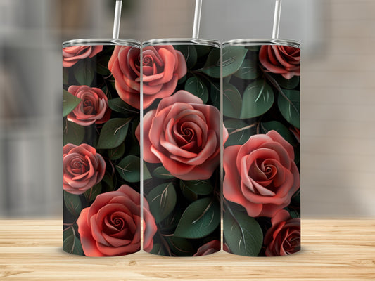 Three tumblers with a rose floral pattern, on a wooden surface.