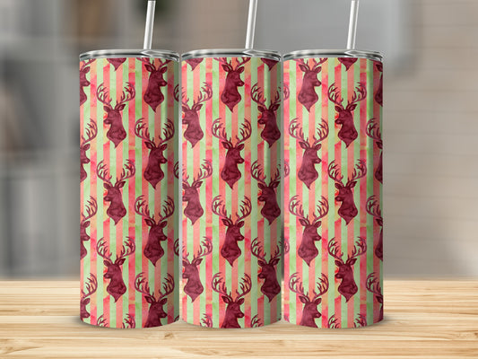 Three tumblers with deer head and striped pattern on a wooden surface.