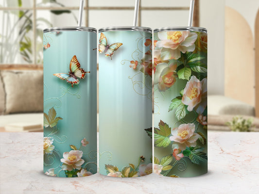 Floral butterflies on a mint green patterned insulated tumbler.