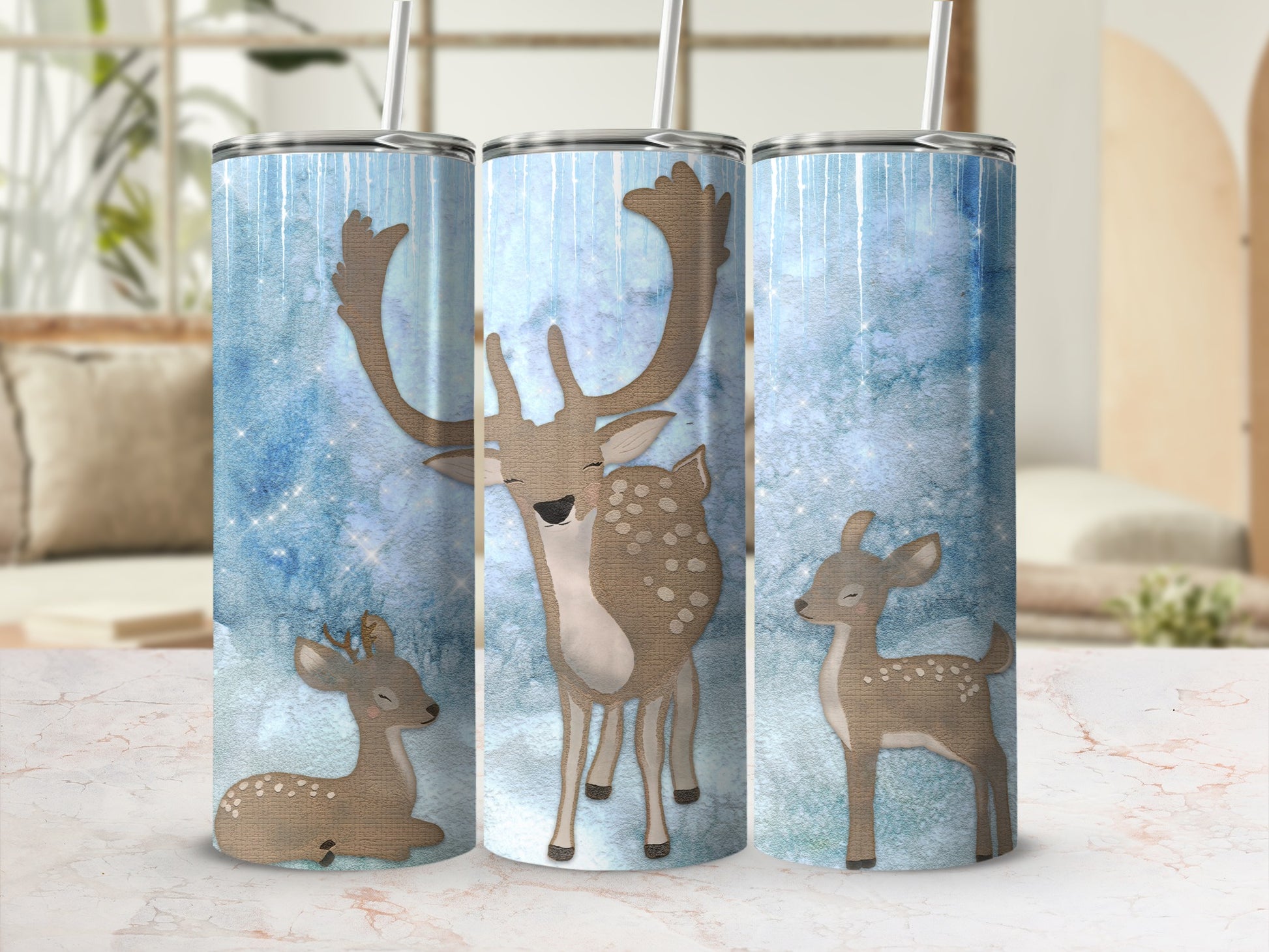 Three tumblers featuring a winter deer design with a blue and white background.
