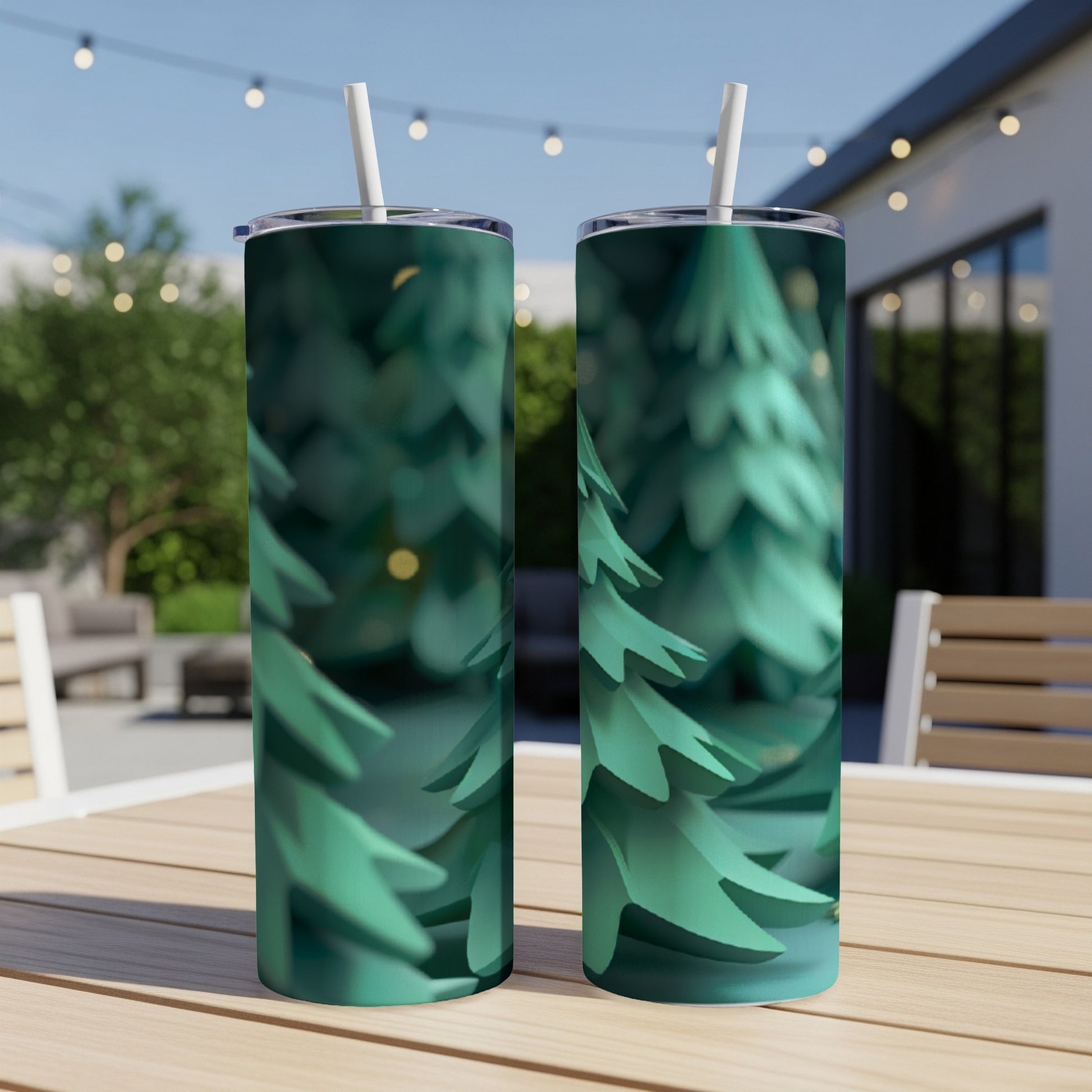 Two green tumblers with a forest pattern sit on a table.