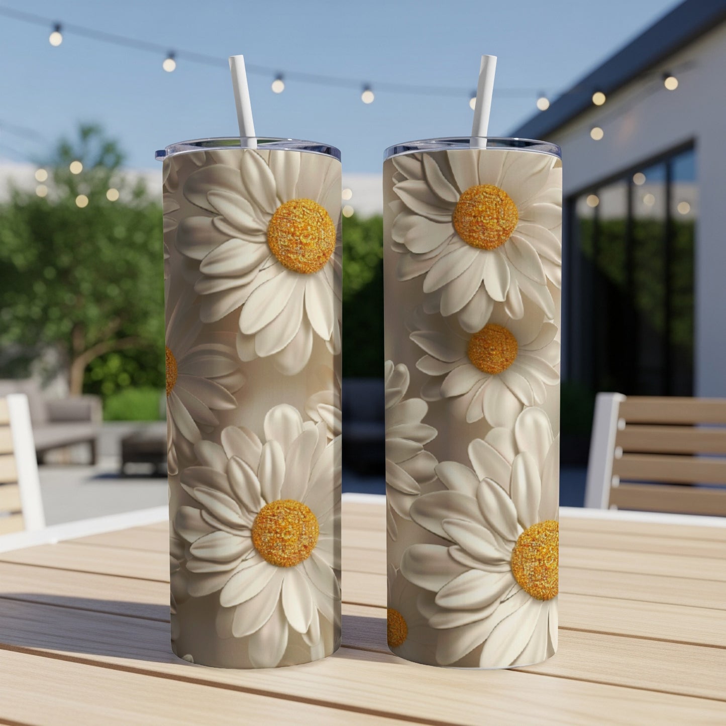 Two white daisy tumblers with yellow centers on a wooden table.