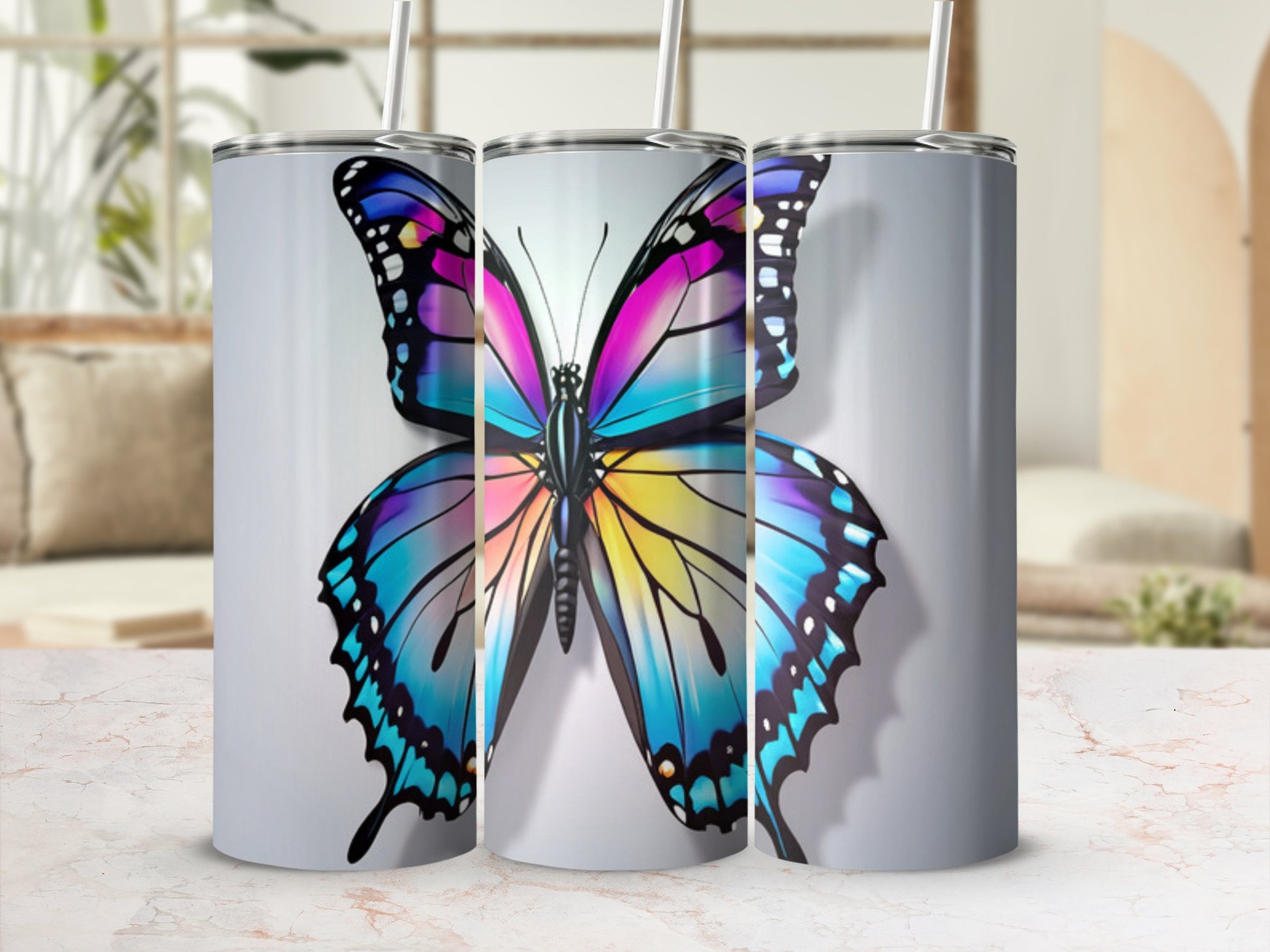 Tall tumbler with colorful butterfly graphic.