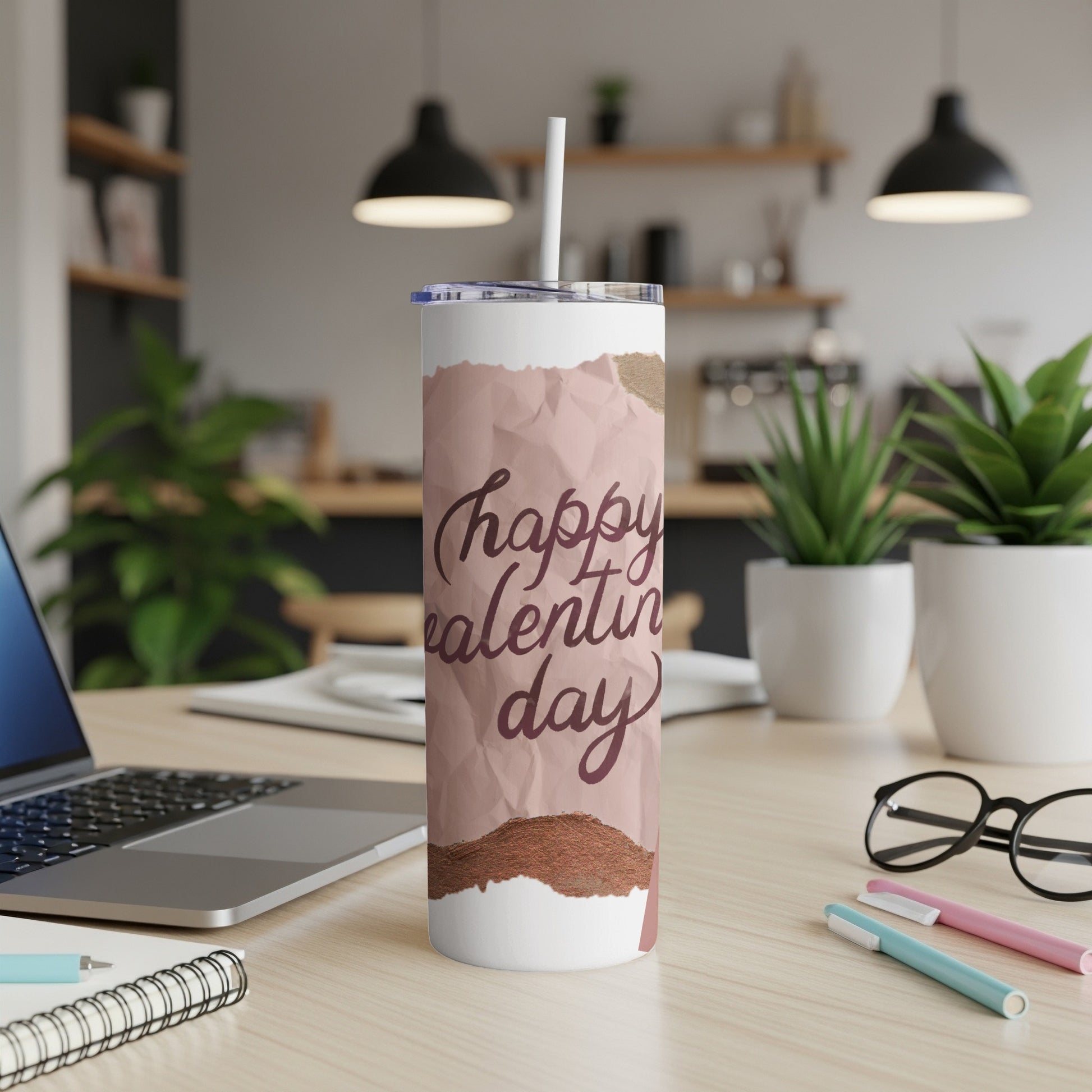 Tumbler with "happy valentine day" text, featuring crumpled paper and metallic accents.