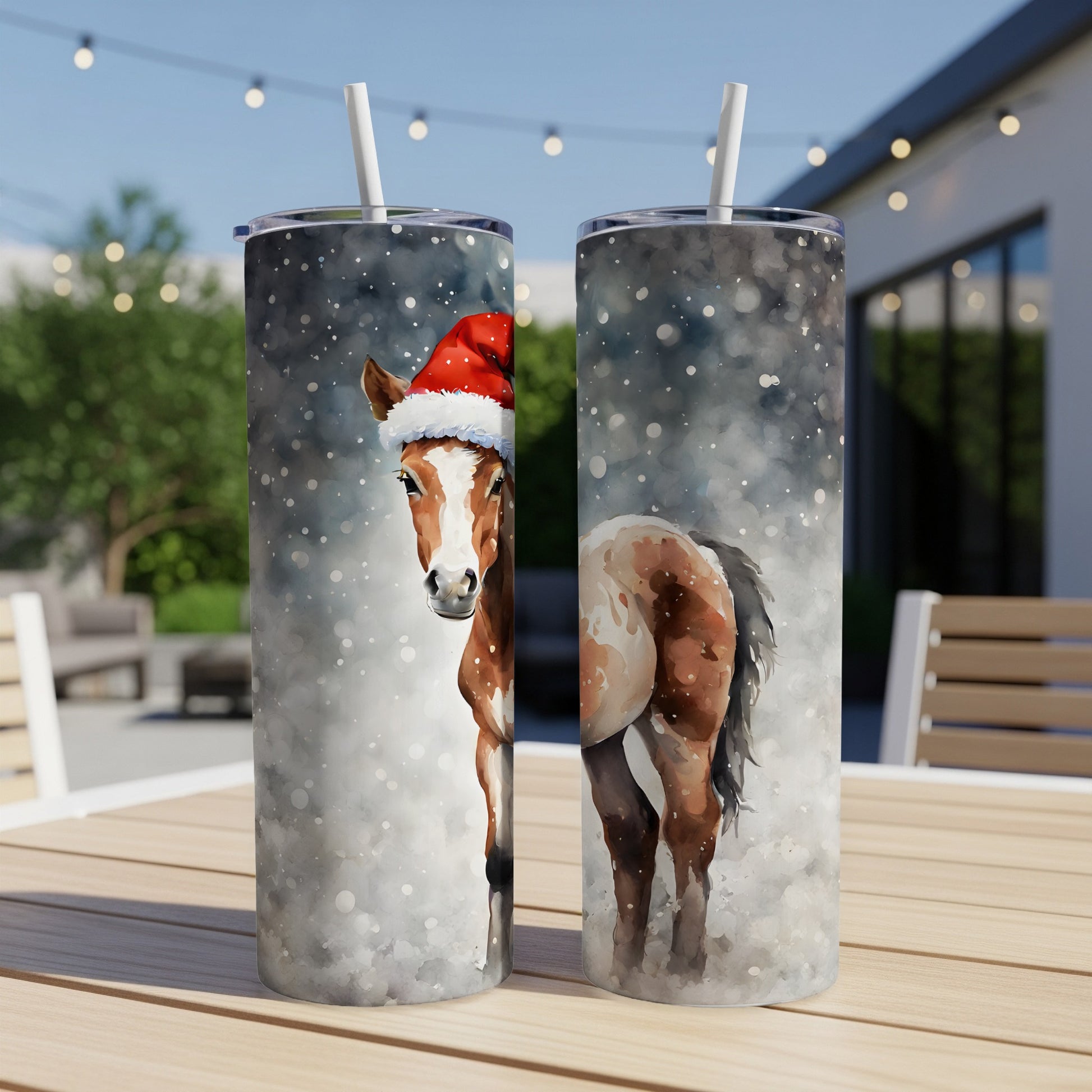 Two tumblers featuring a watercolor painting of a horse wearing a Santa hat.