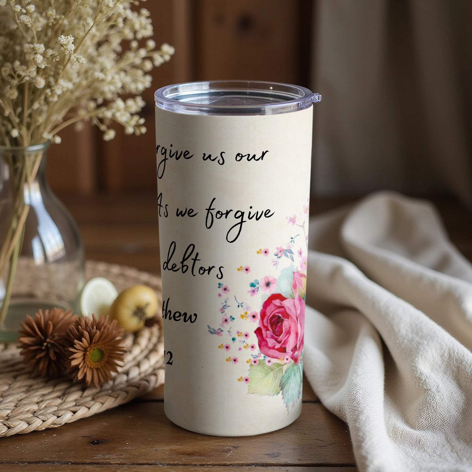Forgive Us Our Debts Floral Design Tumbler Product