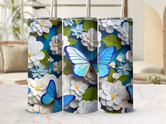 Three tumblers with blue butterflies and white flowers against a blue floral background.